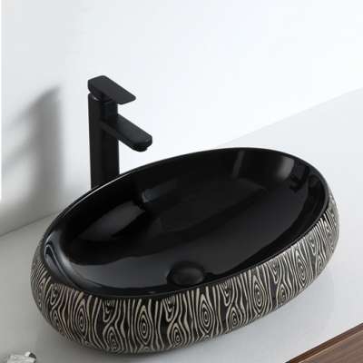 New arrival oval shape bathroom sink surface handmade glossy black countertop ceramic wash basin